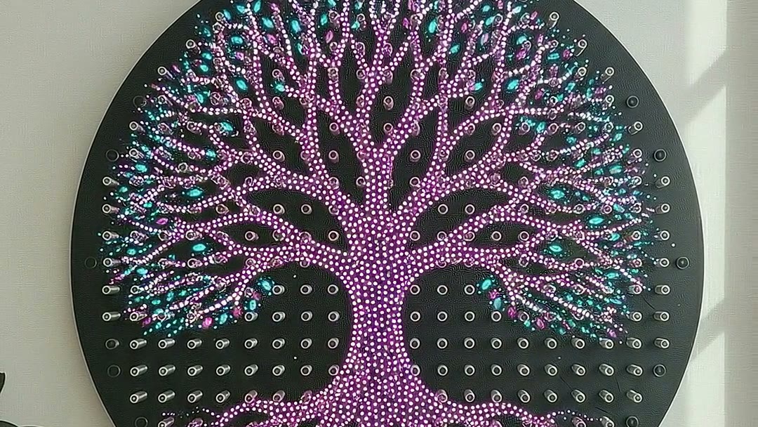 Ripple with nothing playing: a tree of life drawn in purple and cyan light across the springs